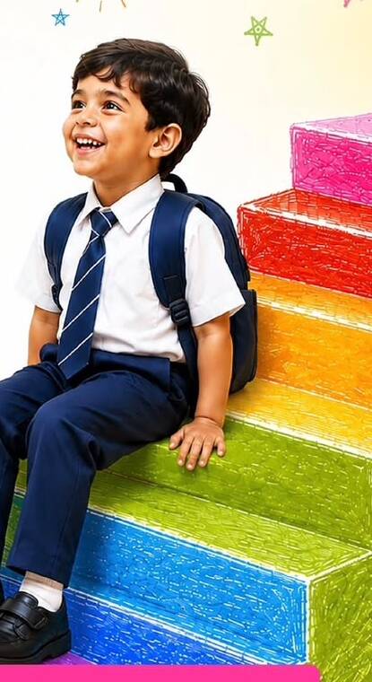 Smiling student seated on colourful steps